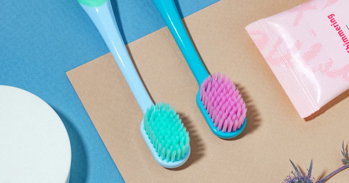 Colorful personal-care products arranged as a flat lay