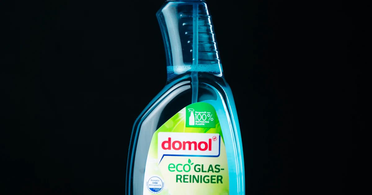 A cleaning-product bottle photographed against a dark background
