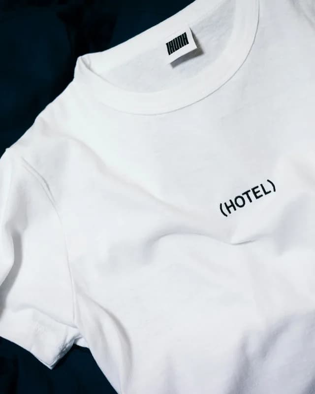 White graphic tee on dark fabric