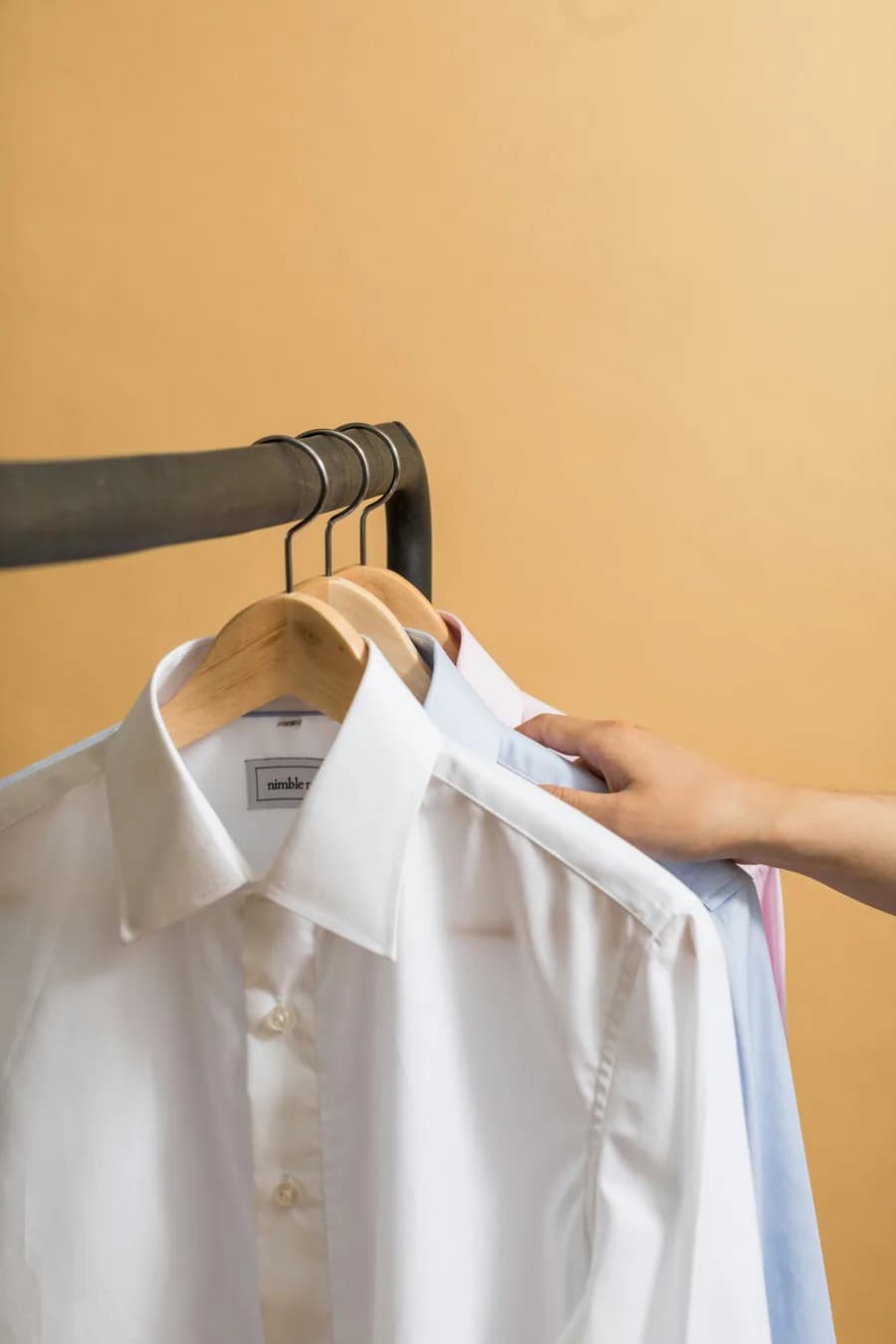White button-up shirt on a hanger