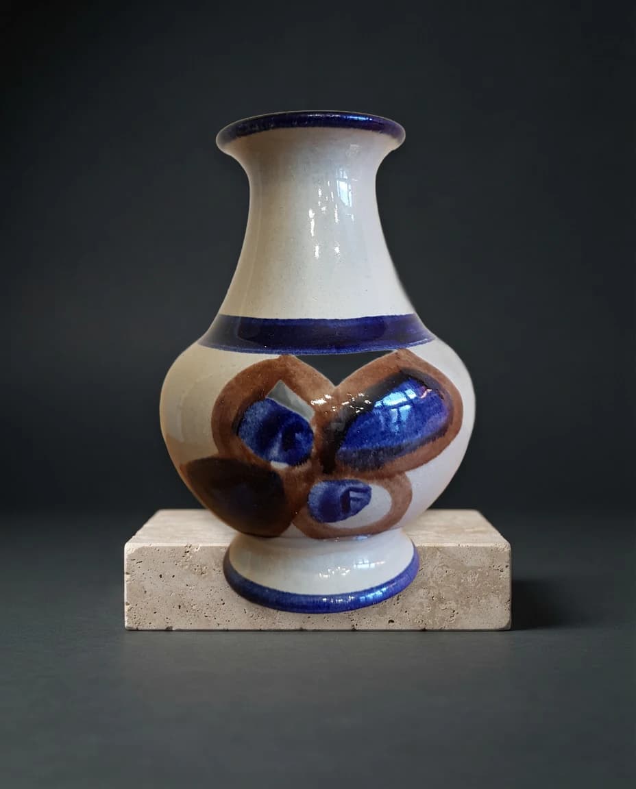 Saved Preserve ceramic vase on a travertine display